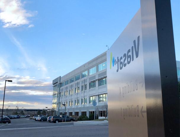 Angled view of the Viasat entrance sign in front of building 1 in Denver, CO